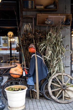 MOSCOW, RUSSIA - OCTOBER 3, 2021: Halloween holiday street decor in Moscow city, Russia. Halloween decoration on facade of restaurant "Black swan". Halloween autumn ornament with fall pumpkins. Shopのeditorial素材