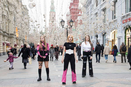 Moscow, Russia- 19 October 2021, Brightly dressed anime girls are dancing on Nikolskaya Street, their girlfriend is filming a video for TIK TOKのeditorial素材