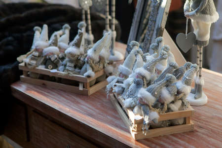 London, UK - 20 September 2021, Gnomes in gray knitted hats for sale before christmas