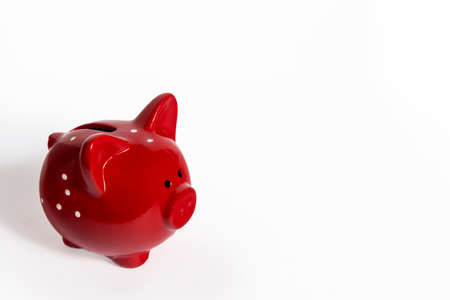 Ceramic red with white polka dots pig isolated on white. Space for text. Copy space