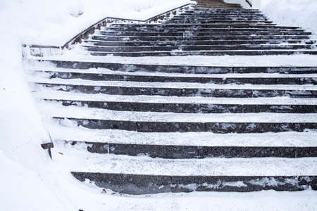 Snow-covered steps leading up to the buildingの写真素材