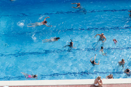 Blanes, Catalonia, Spain. - 25 July 2017, Top view of the municipal swimming pool in a residential complex with people floating.のeditorial素材