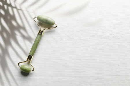 Massage set "Guasha" jade green, roller and scraperの写真素材