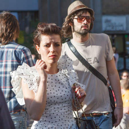 London, UK - September 2019, Busy time on Sunday at the brick lane market near cafe 1001. Fashionably dressed girls pass by the crowdのeditorial素材