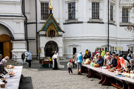 Moscow, Russia - 24 April 2022, Believers gathered to consecrate Easter cakes and Easter on Orthodox Easter at the Novospassky Monastery.のeditorial素材
