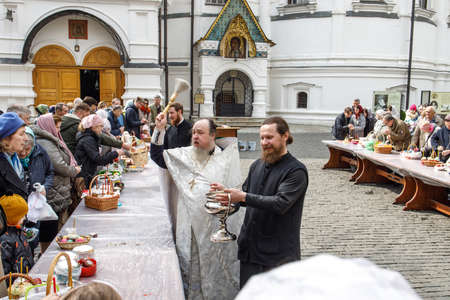 Moscow, Russia - 24 April 2022, Believers gathered to consecrate Easter cakes and Easter on Orthodox...