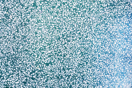 Fragment of a ceramic floor with green stones. texture background. texture with colorful spots, for...