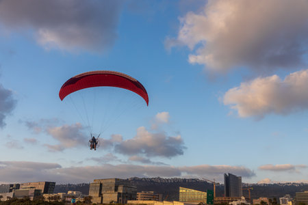 Motor hang glider in the blue morning sky at desert