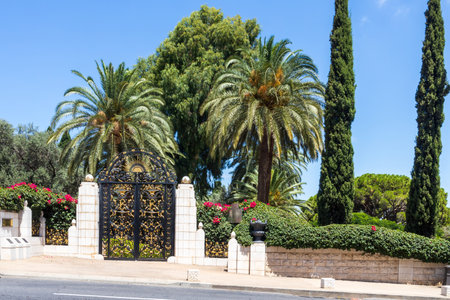 Haifa, Israel, July 12, 2022 : The decorative metal gate at the entrance to the middle terrace of the Bahai Garden, located on Mount Carmel in the city of Haifa, in northern Israelの写真素材
