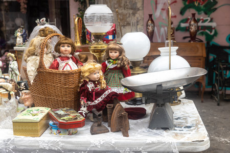 Haifa, Israel - September 02, 2022, Soviet-made baby doll in the style of the seventies in a knitted hat and dress on a table at a flea market.のeditorial素材