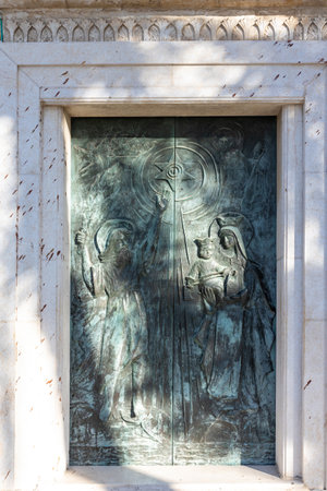 Haifa, Israel - 06.10.2022, The religious bas-relief on the main entrance door of the Stella Maris Monastery which is located on Mount Carmel in Haifa city in northern Israelの写真素材