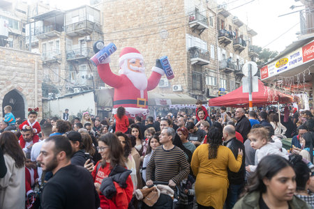 Haifa, Israel - December 17, 2022 : Pupils of St. Elias Episcopal school participate in the Christmas parade in the German Colony. Spectators watch the paradeのeditorial素材