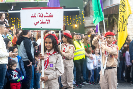 Haifa, Israel - December 17, 2022 : Pupils of St. Elias Episcopal school participate in the Christmas parade in the German Colony. Spectators watch the paradeのeditorial素材