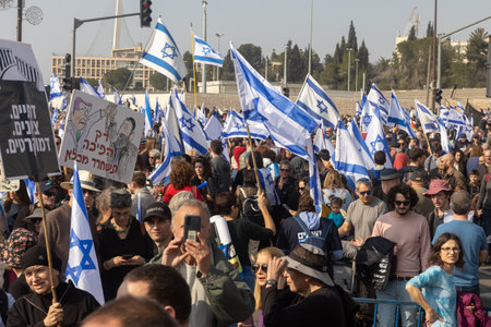 JERUSALEM, ISRAEL - February 20 2023: Israelis protest near the Knesset against plans by prime minister Benjamin Netanyahu new government to trample the legalのeditorial素材