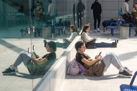 JERUSALEM, ISRAEL - February 20 2023: The girl is sitting on the floor, leaning against the mirror...