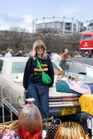 London UK - April 15 2023: Classic Car Boot Sale by Vintage. Retro festival. People selling vintage...