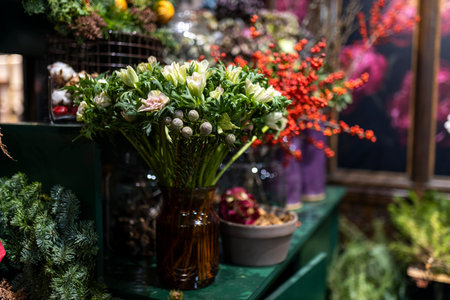 A variety of colors is near the flower shop. Large bouquets in tin vases.の写真素材