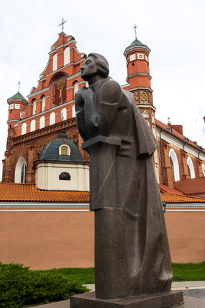 VILNIUS, LITHUANIA - JUNE 15 2023: View of the Roman catholic Church of St. Francis and St. Bernard and St. Anne's Church in Vilnius, Adam Mickiewicz statueのeditorial素材