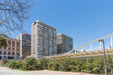 Valencia, Spain - April 19, 2024: Alameda Bridge and Subway Station by Santiago Calatrava. The modern design makes the bridge an attraction in the city. Sunny weather. Modern building.のeditorial素材