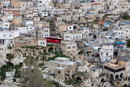 Cappadocia, Turkey -24 April 2024, View of the town of Ortahisar with the minaret of the mosque in the foreground and the valley of Cappadocia in the background near the town of Goreme,のeditorial素材