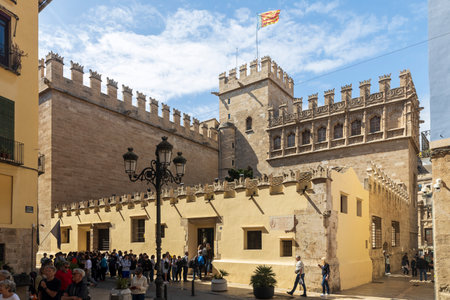 Valencia, Spain - April 20, 2024. The faÃ§ade of the Silk Exchange - The Lonja de la Seda or Llotja de la Seda is a late Valencian Gothic-style civil building. People queue at the ticket office to enter the museumのeditorial素材
