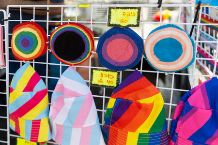 Haifa, Israel. Pride Parade. Knitted rainbow kippahs and panamas for sale.の写真素材