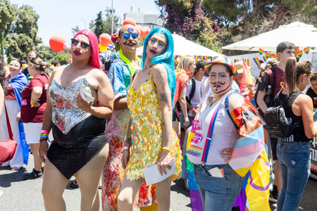 Haifa, Israel June 21, 2024, Pride Parade. Drag queens pose in the crowd. One of them wears glasses with three lenses.のeditorial素材