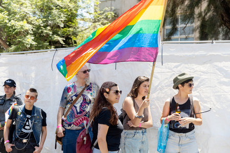 Haifa, Israel June 21, 2024, Pride. People with makeup and rainbow flags in the crowd.のeditorial素材