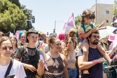Haifa, Israel June 21, 2024, Pride. People with makeup and rainbow flags in the crowd.のeditorial素材