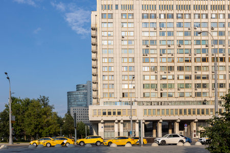 Moscow, Russia - July 16, 2024, yellow taxis near the high-rise library building near the Serpukhovskaya metro stationのeditorial素材