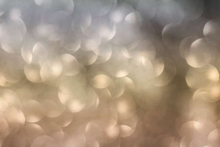 Bokeh background with layers of bronze, silver and goldの写真素材
