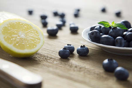 closeup portrait of blueberries on wood topの写真素材