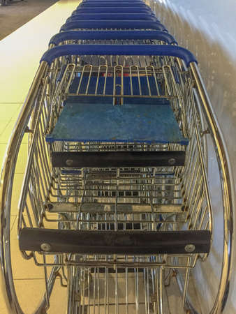 Metal shopping trolley stacked into each otherの写真素材