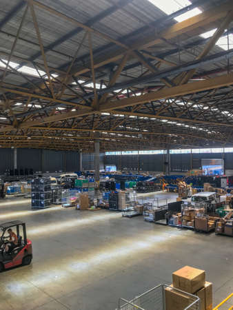Tuesday Feb 12th 2019,Auckland New Zealand - A courier depot during the day time is abuzz with activity sorting the freight.のeditorial素材