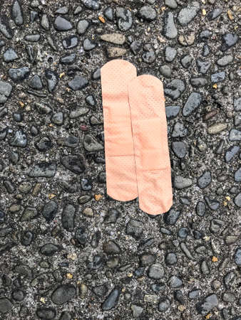 Overhead perspective of wound seal plaster on gravel backgroundの写真素材