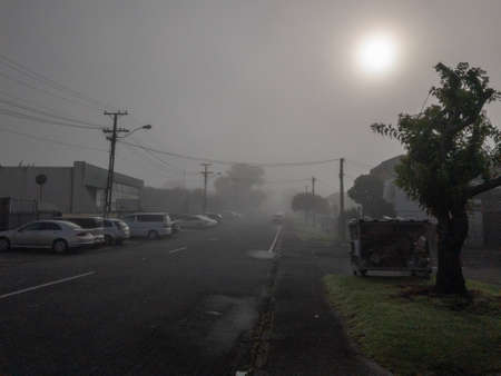 Blurry misty road on a foggy morning in Auckland cityの写真素材