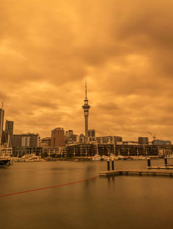 Orange cloudy skies over Auckland Cityの写真素材