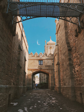 A picturesque view of the Vorontsov Palace in Crimea, with a passage between the walls leading to an...