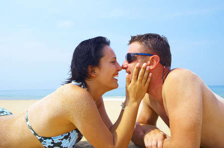 a portrait of attractive couple having fun on the beachの写真素材