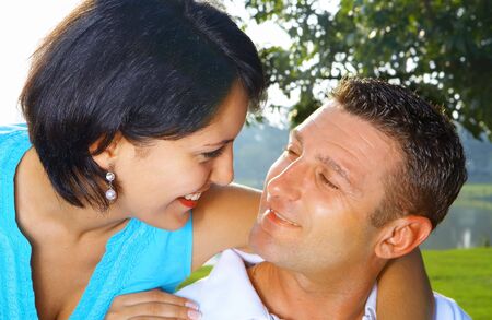 a portrait of attractive couple in summer environment