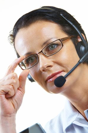view of nice operator in stylish glasses at her working placeの写真素材