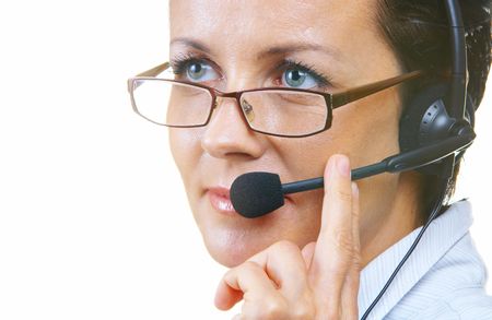 view of nice operator in stylish glasses at her working placeの写真素材