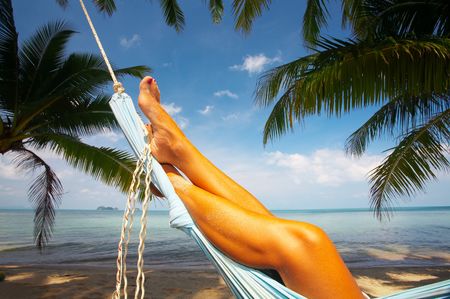 view of nice smooth woman's legs in tropical blissの写真素材