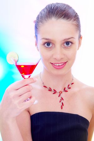 high-key portrait of young woman with cocktail  in multicolor back lightsの写真素材