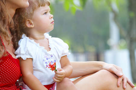 Outdoor  portrait of happy mother with  の写真素材