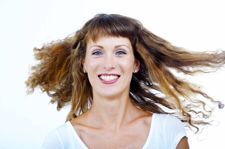Stylish shot of nice young long hair woman on white backの写真素材