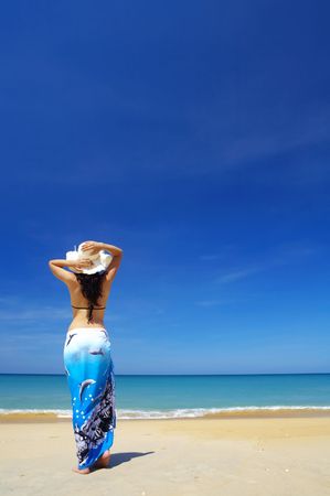 view of  female back on a background of the tropical seaの写真素材