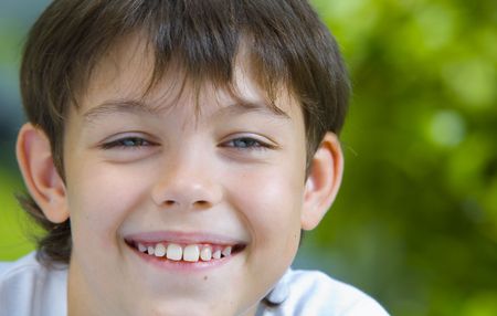 Portrait of happy smiling  kid in summer environment
