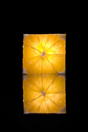 View of fresh orange slice on black backの写真素材