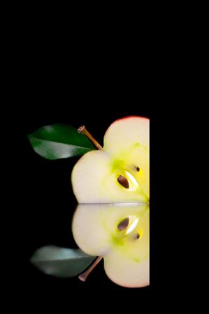 View of fresh apple slices on black backの写真素材